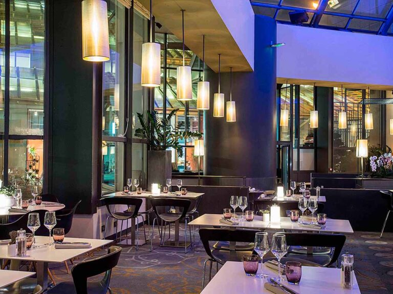 Contemporary restaurant at Novotel Paris Les Halles, offering a chic dining space